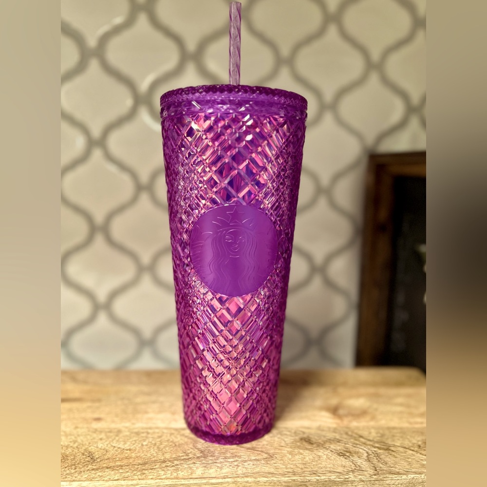Purple holographic cold drink Starbucks cup with straw.